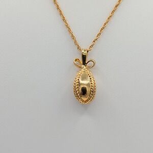 Signed Joan Rivers Classics Faberge Gold Tone Bow Egg Pendant Necklace